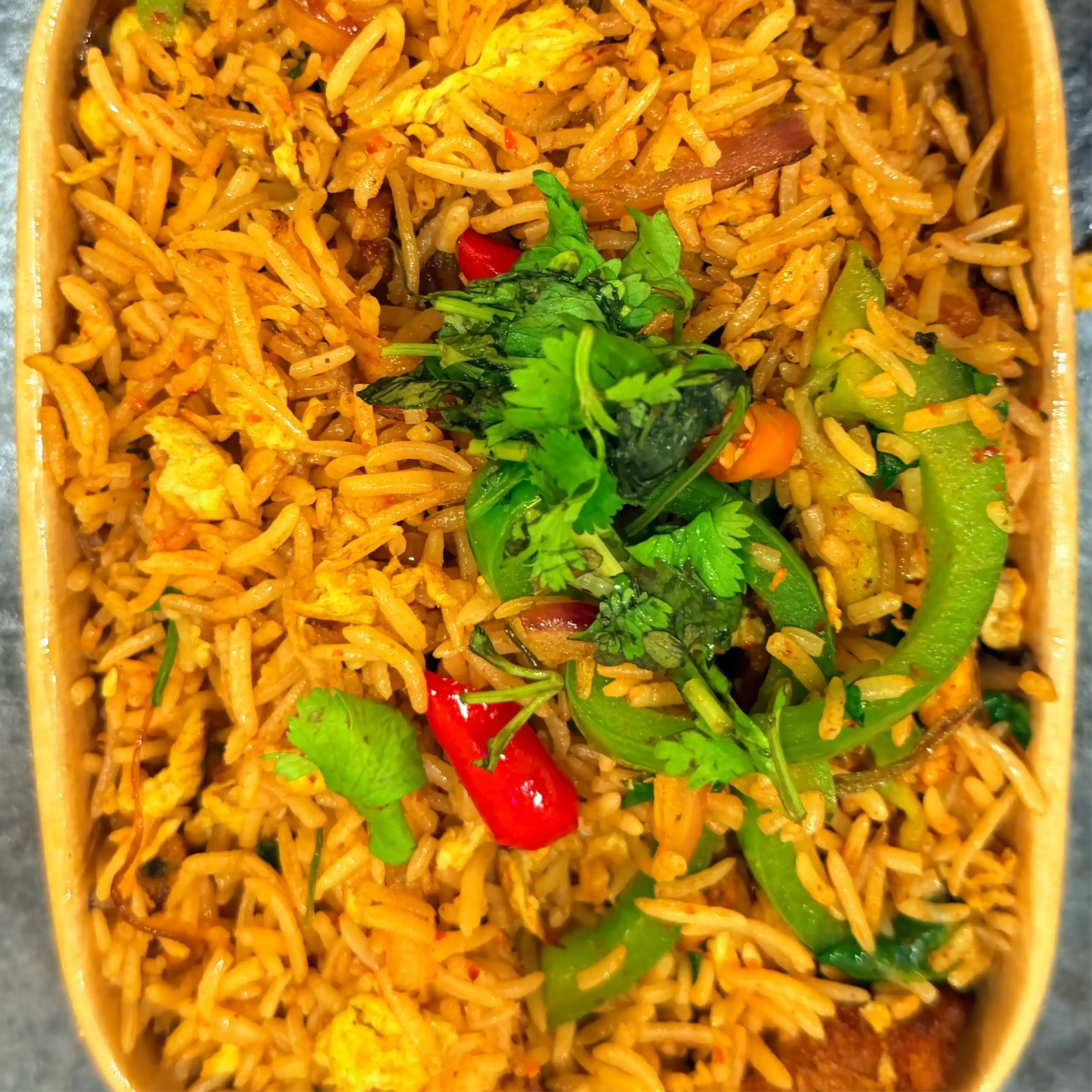 Thai Chilli Fried Rice - Chicken — Experience a fiery symphony of flavors with our Thai Chilli Fried Rice at Hashtag India, Overland Park